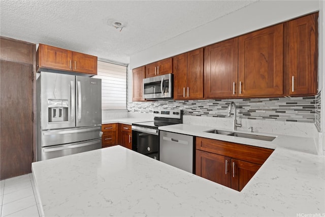 500 University Ave Unit 509, Honolulu, HI 96826 - kitchen with stainless steel appliances, a sink, a textured ceiling, backsplash, and light stone countertops
