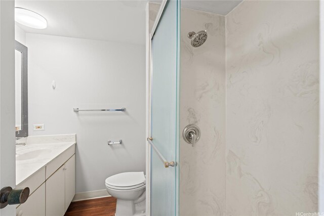 500 University Ave Unit 509, Honolulu, HI 96826 - full bathroom with a marble finish shower, vanity, toilet, wood finished floors, and baseboards