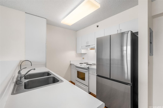 3009 Ala Makahala Pl Unit 905, Honolulu, HI 96818 - kitchen featuring freestanding refrigerator, white electric range oven, under cabinet range hood, a sink, and light countertops