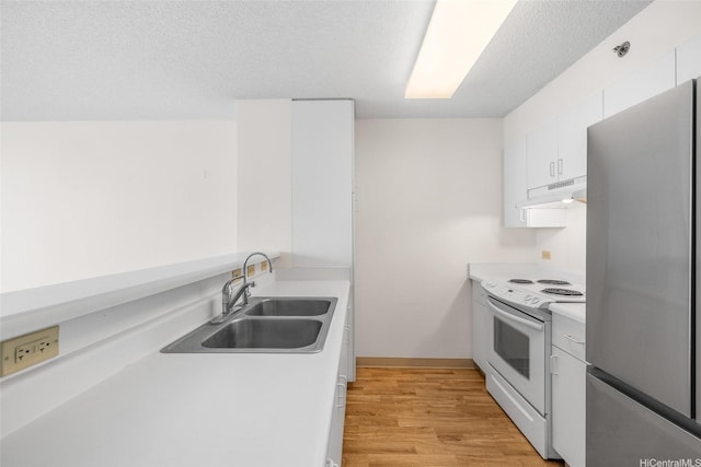 3009 Ala Makahala Pl Unit 905, Honolulu, HI 96818 - kitchen featuring freestanding refrigerator, white range with electric stovetop, a sink, under cabinet range hood, and light countertops