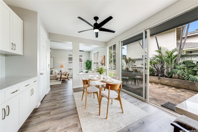 91-208 Kekepania Pl Unit B, Kapolei, HI 96707 - dining space with light wood-style floors, a ceiling fan, and baseboards
