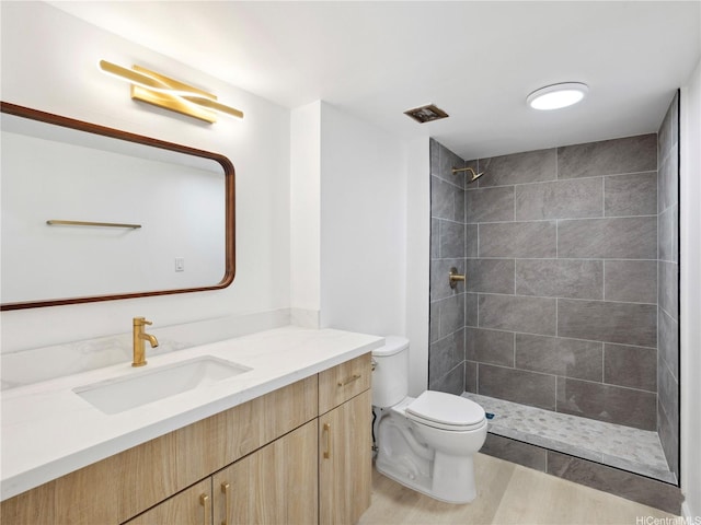 1620 Keeaumoku St Unit 506, Honolulu, HI 96822 - full bath with toilet, vanity, a tile shower, and wood finished floors