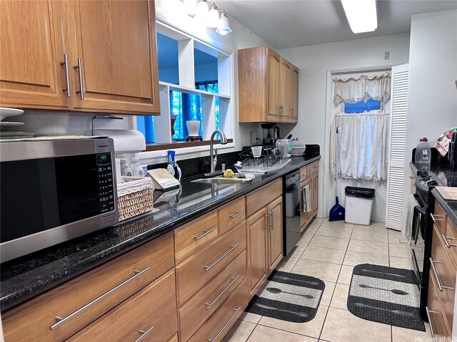 94-070 Akualele Pl, Mililani, HI 96789 - kitchen with a sink, black appliances, light tile patterned floors, dark stone countertops, and brown cabinets