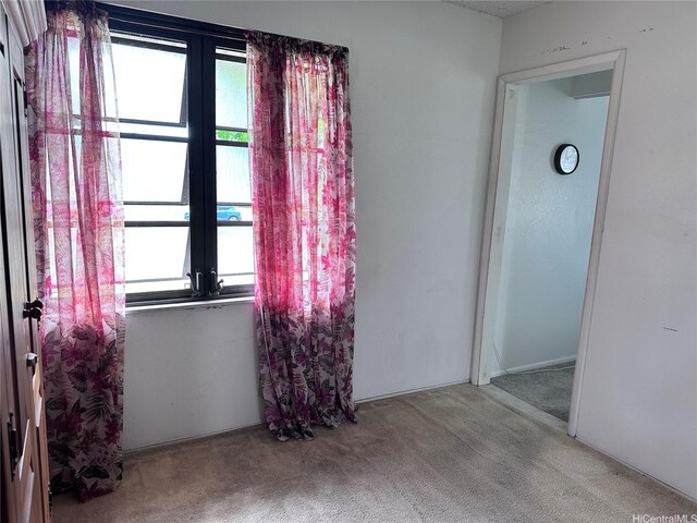 94-070 Akualele Pl, Mililani, HI 96789 - empty room featuring french doors, carpet, and healthy amount of natural light