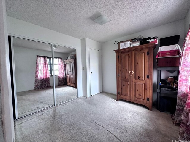 94-070 Akualele Pl, Mililani, HI 96789 - unfurnished bedroom with light carpet and a textured ceiling