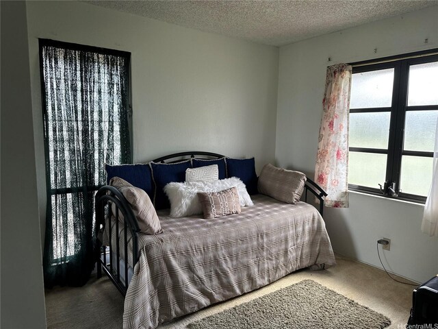 94-070 Akualele Pl, Mililani, HI 96789 - carpeted bedroom featuring multiple windows and a textured ceiling