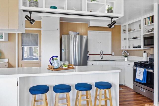538 Akahi Pl, Lanai City, HI 96763 - kitchen with appliances with stainless steel finishes, open shelves, a sink, light countertops, and white cabinets