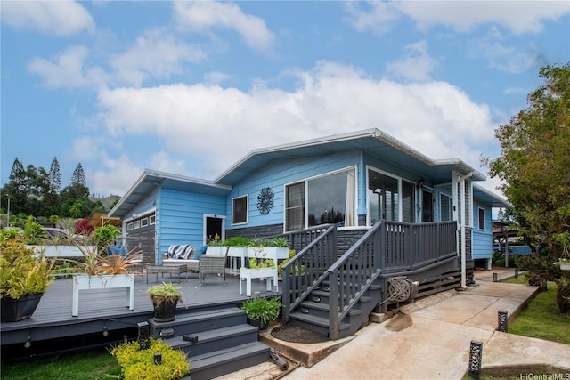 538 Akahi Pl, Lanai City, HI 96763 - back of house with a deck and a garage