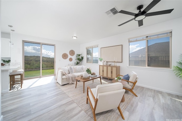 92-735 Welo St, Kapolei, HI 96707 - living area featuring light wood-type flooring, ceiling fan, and baseboards