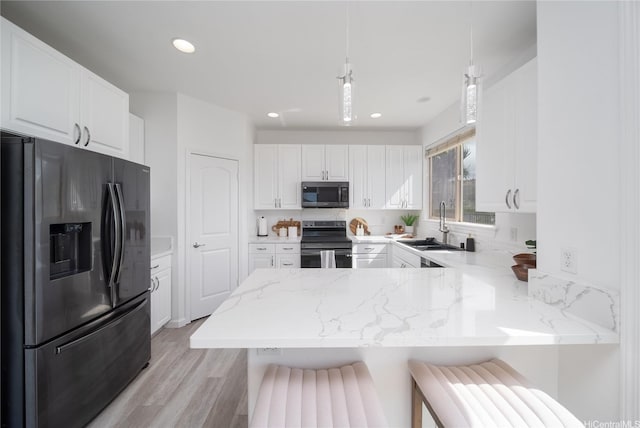 92-735 Welo St, Kapolei, HI 96707 - kitchen featuring refrigerator with ice dispenser, stainless steel microwave, range with electric cooktop, a peninsula, and a sink