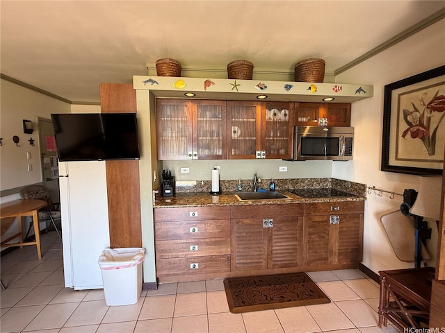 255 Kepuhi Pl Unit 4A02-1242, Maunaloa, HI 96770 - kitchen with stainless steel microwave, crown molding, light tile patterned flooring, glass insert cabinets, and black electric cooktop