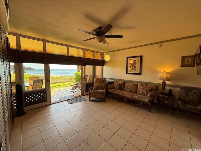 255 Kepuhi Pl Unit 4A02-1242, Maunaloa, HI 96770 - living room with light tile patterned floors, a ceiling fan, and view of water and beach