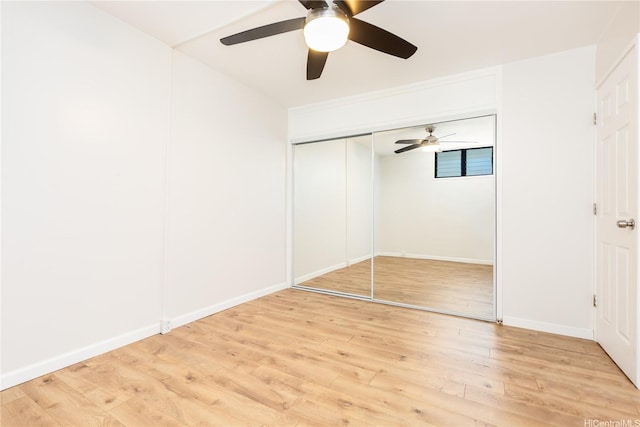 1005 Ala Lilikoi St Unit W201, Honolulu, HI 96818 - unfurnished bedroom featuring light wood-type flooring, baseboards, and ceiling fan