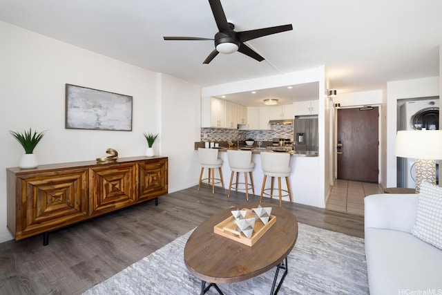 475 Atkinson Dr Unit 608, Honolulu, HI 96814 - living area featuring a ceiling fan and light wood-style floors