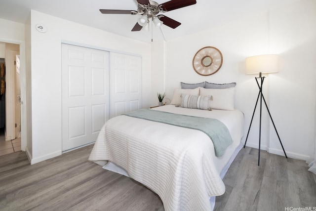 475 Atkinson Dr Unit 608, Honolulu, HI 96814 - bedroom with wood finished floors, a closet, baseboards, and a ceiling fan