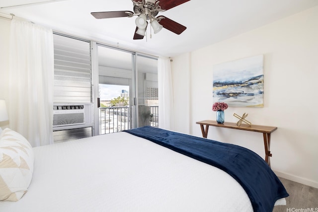 475 Atkinson Dr Unit 608, Honolulu, HI 96814 - bedroom featuring access to outside, baseboards, a ceiling fan, wood finished floors, and cooling unit