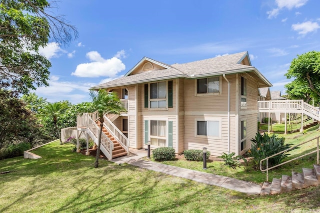 92-1151 Palahia St Unit B206, Kapolei, HI 96707 - view of front of house with stairs, a front lawn, and a shingled roof