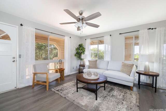 92-1151 Palahia St Unit B206, Kapolei, HI 96707 - living room featuring wood finished floors, a ceiling fan, and baseboards