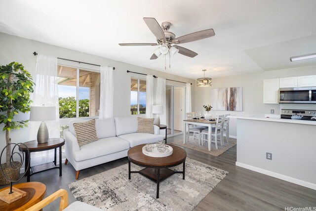 92-1151 Palahia St Unit B206, Kapolei, HI 96707 - living room featuring baseboards, dark wood finished floors, and ceiling fan