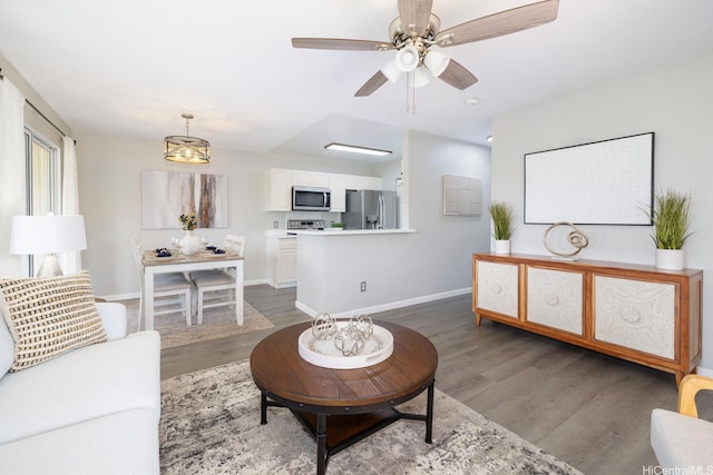 92-1151 Palahia St Unit B206, Kapolei, HI 96707 - living room featuring wood finished floors, baseboards, and a ceiling fan