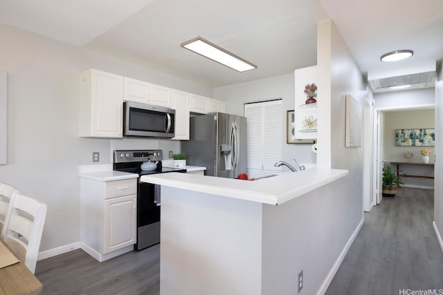 92-1151 Palahia St Unit B206, Kapolei, HI 96707 - kitchen featuring stainless steel appliances, wood finished floors, baseboards, and white cabinetry