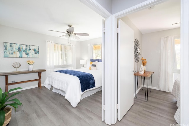 92-1151 Palahia St Unit B206, Kapolei, HI 96707 - bedroom featuring light wood finished floors, baseboards, and ceiling fan
