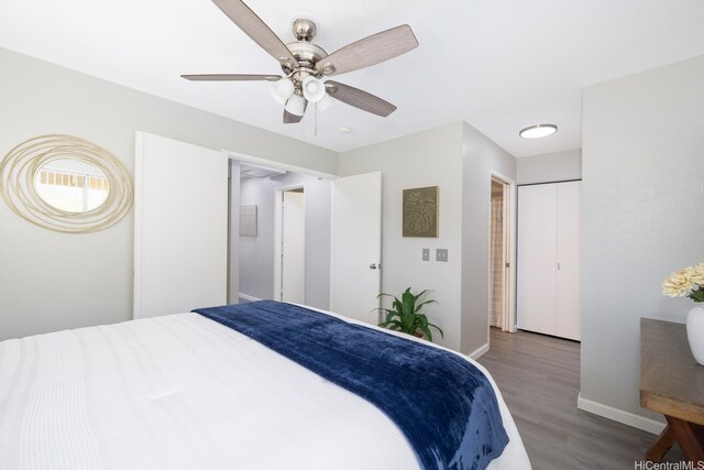 92-1151 Palahia St Unit B206, Kapolei, HI 96707 - bedroom with wood finished floors, baseboards, and a ceiling fan