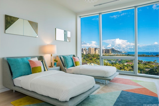1118 Ala Moana Blvd Unit 1000, Honolulu, HI 96814 - bedroom with wood finished floors and a water view