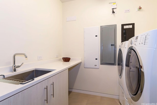 1118 Ala Moana Blvd Unit 1000, Honolulu, HI 96814 - laundry room featuring separate washer and dryer, cabinet space, electric panel, and light tile patterned floors