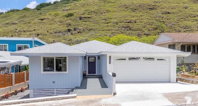 1504 Ainakoa Ave, Honolulu, HI 96821 - view of front of home with a garage, concrete driveway, and a shingled roof