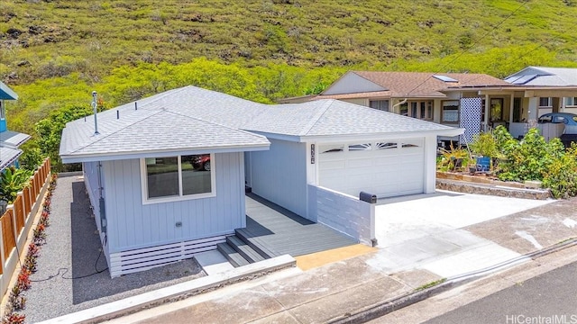 1504 Ainakoa Ave, Honolulu, HI 96821 - single story home featuring a garage, driveway, and roof with shingles