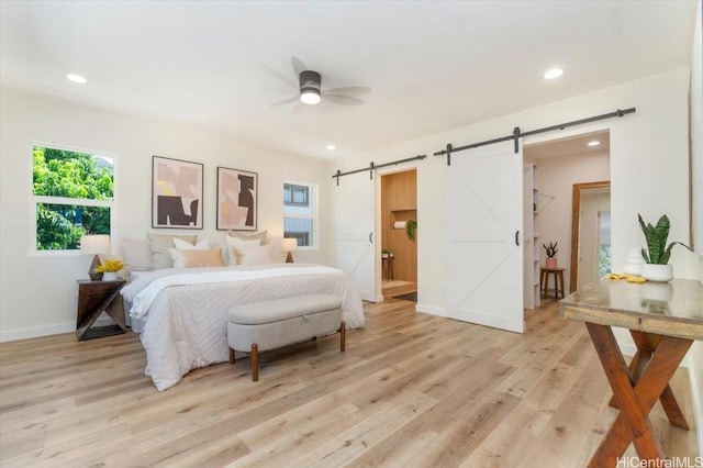 1504 Ainakoa Ave, Honolulu, HI 96821 - bedroom with a barn door, light wood-style floors, recessed lighting, and baseboards