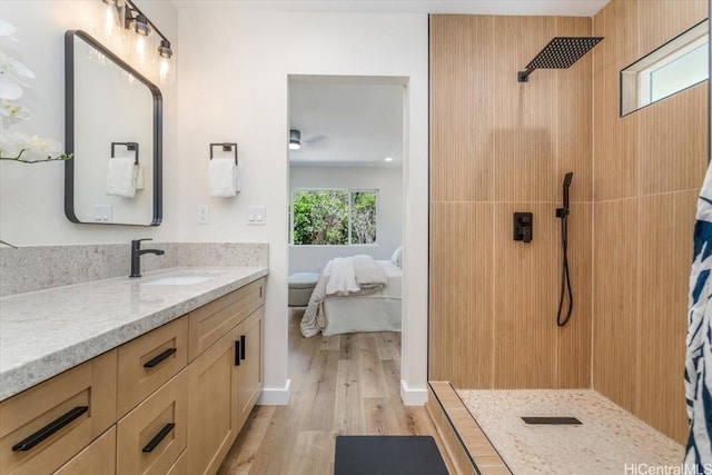 1504 Ainakoa Ave, Honolulu, HI 96821 - ensuite bathroom featuring walk in shower, wood finished floors, vanity, and a ceiling fan