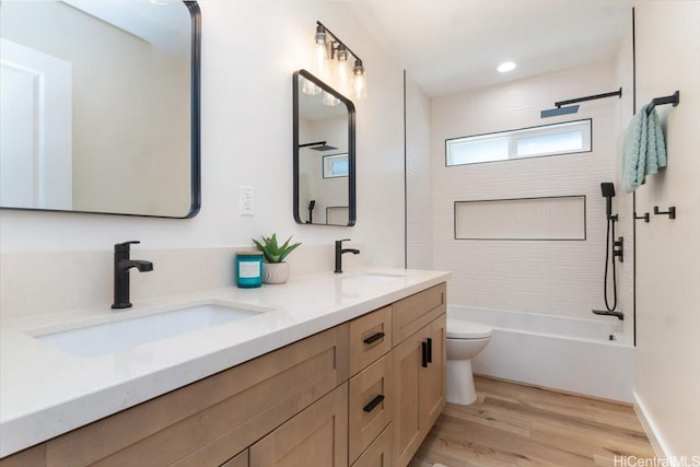 1504 Ainakoa Ave, Honolulu, HI 96821 - bathroom with toilet, double vanity, wood finished floors, and shower / washtub combination