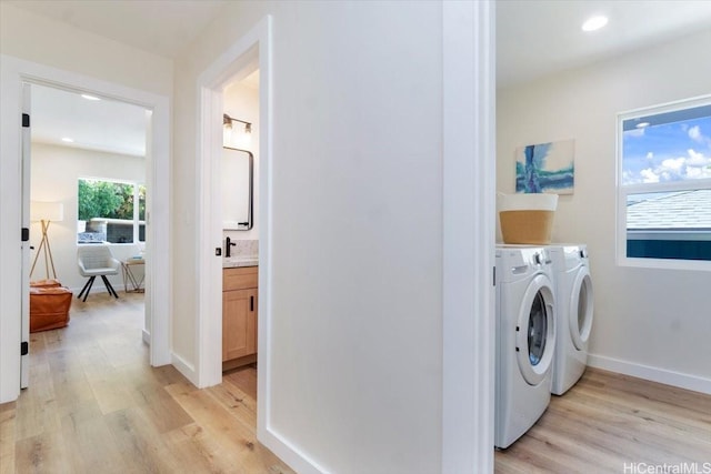 1504 Ainakoa Ave, Honolulu, HI 96821 - laundry area with separate washer and dryer, light wood-style floors, recessed lighting, and baseboards