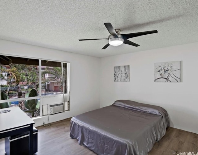 95-510 Wikao St Unit B201, Mililani, HI 96789 - bedroom featuring wood finished floors, a textured ceiling, ceiling fan, and billiards