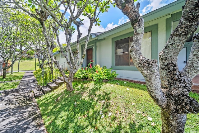 98-1712 Kaahumanu St Unit 11A, Pearl City, HI 96782 - view of side of home featuring a yard