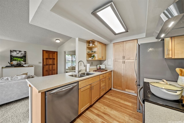 98-1712 Kaahumanu St Unit 11A, Pearl City, HI 96782 - kitchen with stainless steel appliances, a sink, wall chimney range hood, open floor plan, and light wood finished floors