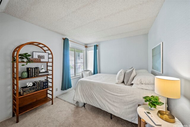 98-1712 Kaahumanu St Unit 11A, Pearl City, HI 96782 - bedroom featuring carpet and a textured ceiling