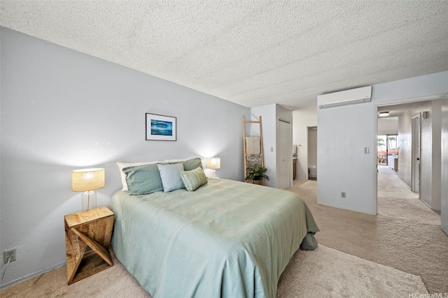 98-1712 Kaahumanu St Unit 11A, Pearl City, HI 96782 - bedroom featuring a wall mounted AC, light colored carpet, and a textured ceiling