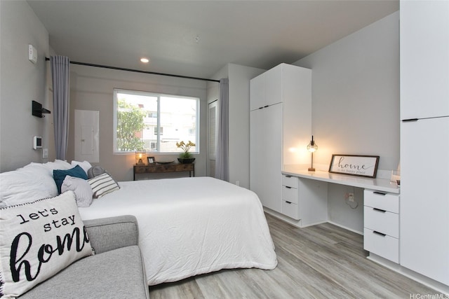 91-3575 Kamolehonua St Unit 902, Ewa Beach, HI 96706 - bedroom with light wood finished floors, freestanding refrigerator, recessed lighting, and electric panel