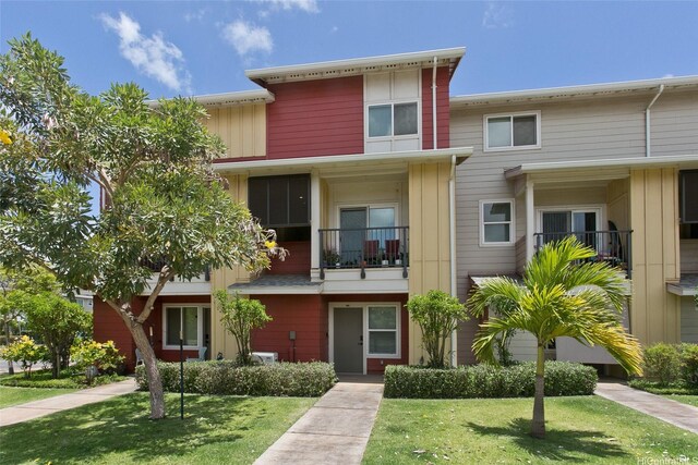 91-3575 Kamolehonua St Unit 902, Ewa Beach, HI 96706 - townhome / multi-family property with a front lawn
