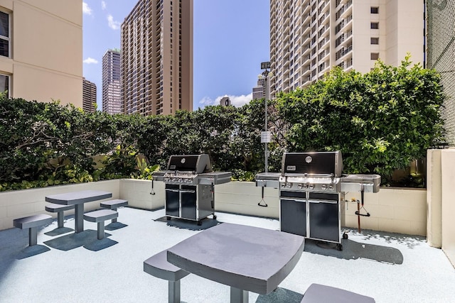 469 Ena Rd Unit 901, Honolulu, HI 96815 - view of patio / terrace with a city view and a grill