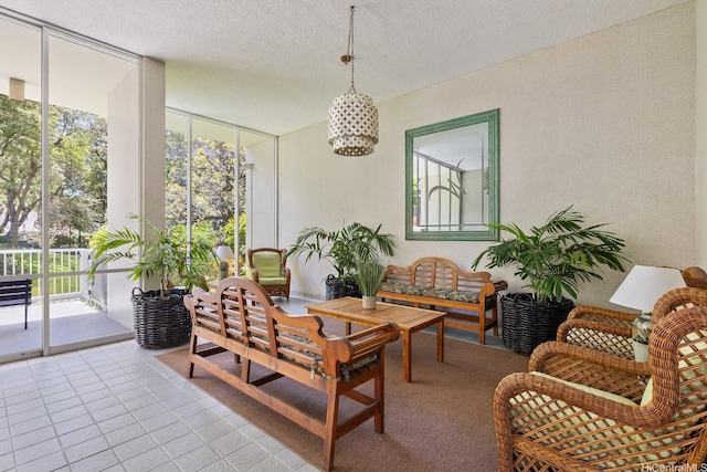 469 Ena Rd Unit 901, Honolulu, HI 96815 - living area with expansive windows, a textured ceiling, light tile patterned floors, and a chandelier