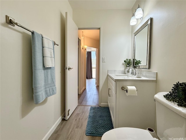 95-2055 Waikalani Pl Unit B204, Mililani, HI 96789 - bathroom featuring toilet, vanity, wood finished floors, and baseboards