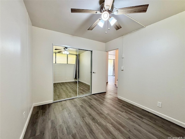 95-2055 Waikalani Pl Unit B204, Mililani, HI 96789 - unfurnished bedroom with wood finished floors, baseboards, ceiling fan, and a closet