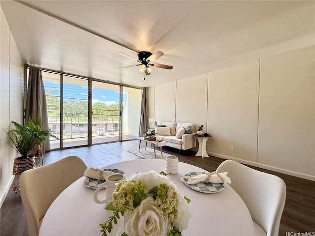 95-2055 Waikalani Pl Unit B204, Mililani, HI 96789 - dining space with dark wood finished floors, a wall of windows, ceiling fan, and baseboards