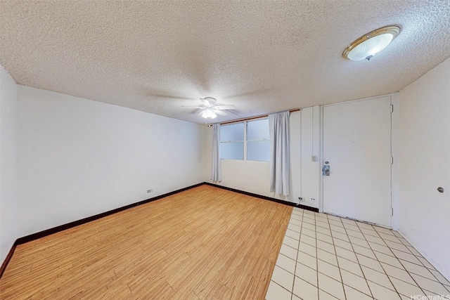 1911 Kalakaua Ave Unit 411, Honolulu, HI 96815 - spare room featuring a ceiling fan, a textured ceiling, and light wood-type flooring