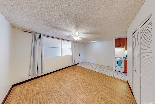 1911 Kalakaua Ave Unit 411, Honolulu, HI 96815 - empty room featuring light wood-type flooring, ceiling fan, and a textured ceiling