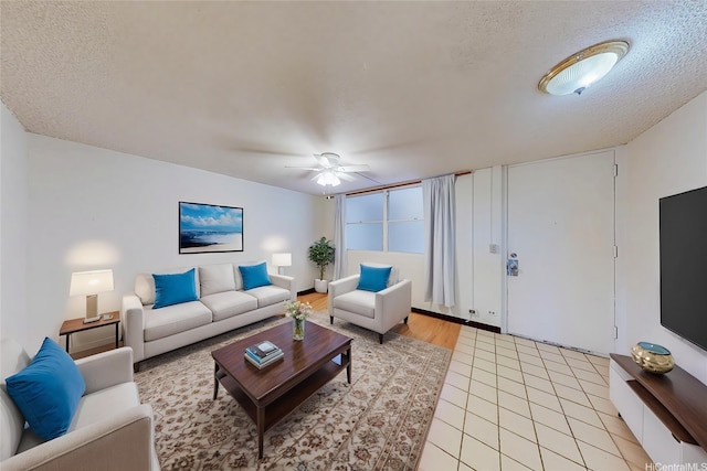 1911 Kalakaua Ave Unit 411, Honolulu, HI 96815 - living room featuring a textured ceiling, ceiling fan, and light tile patterned flooring